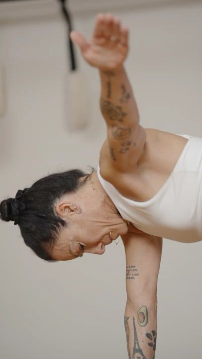 Karina folded forward over the Wunda chair, hands on the pedal. Video: Wunda Chair.